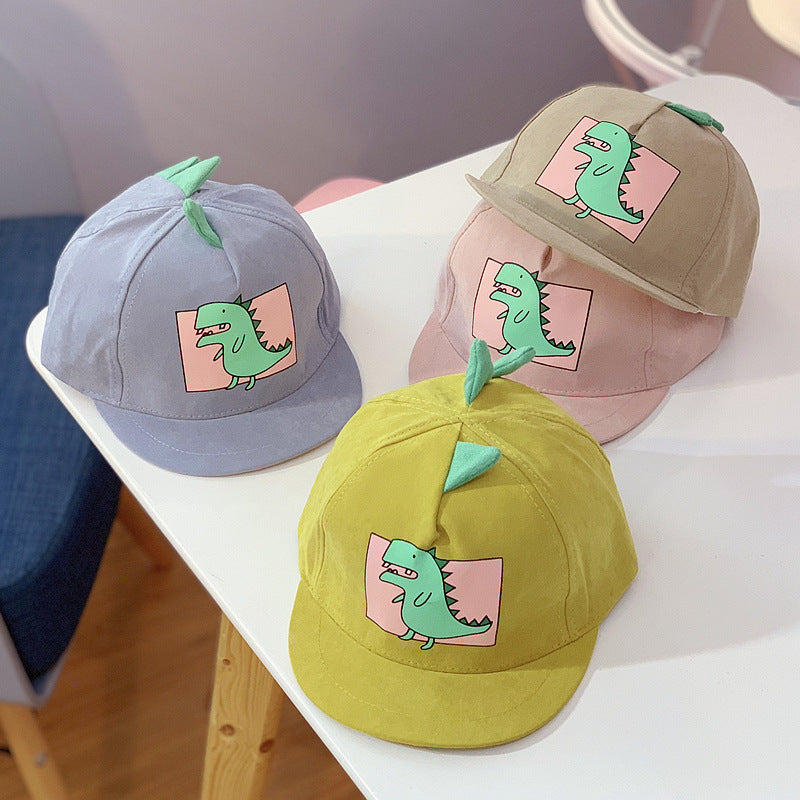 Kid's summer caps in a selection of colours with a green dinosaur print