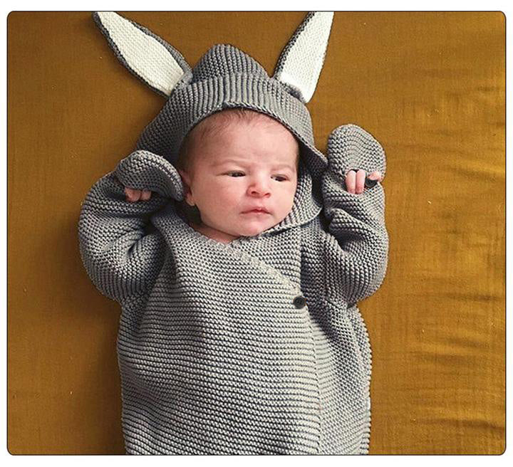 Small baby in grey bunny style sleeping bag